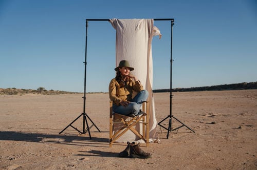 Who lives with camels in the Australian outback?